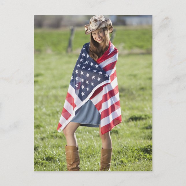 Beautiful cowgirl wrapped in American flag Postcard (Front)