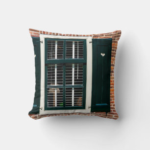 Beautiful dutch traditional houses. Brick wall wit Cushion