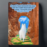 Beautiful Eskie Scripture Plaque Proverbs 16:9<br><div class="desc">Beautiful 5 x 7 Scripture Plaque, with an easel, of a colourful, detailed scene where a gorgeous White American Eskimo Dog is walking on a greenish iridescent stone pathway with red stone walls towards a red rock arched doorway. The doorway opens onto a beautiful blue cloudy sky. This scene accompanies...</div>