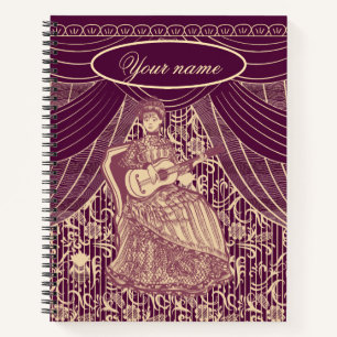 Beautiful lady with guitar notebook