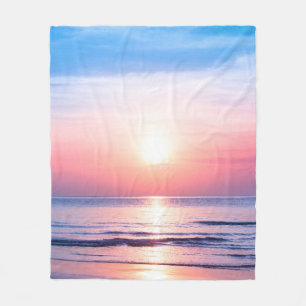 Beautiful morning sunrise, blue sea, pink sky, whi fleece blanket