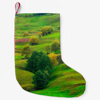 Beautiful mountain landscape in evening sunlight.  small christmas stocking