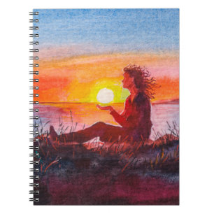 Beautiful ocean sunset. Portrait of young woman as Notebook