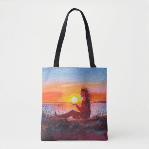 Beautiful ocean sunset. Portrait of young woman as Tote Bag