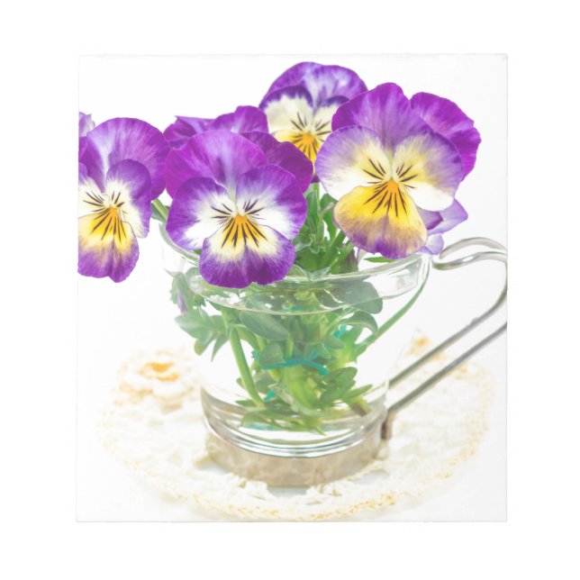 beautiful pansy flowers isolated in a cup notepad (Front)