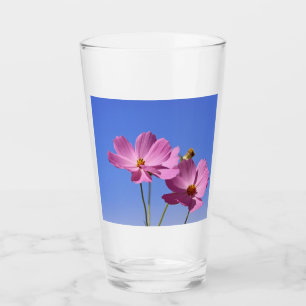 beautiful pink flowers hugging a clear blue sky glass