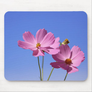 beautiful pink flowers hugging a clear blue sky mouse pad