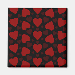 Beautiful red heart pattern on black magnet