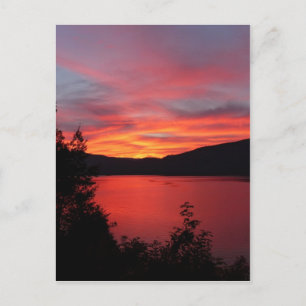 Beautiful red sunrise over a lake postcard