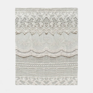 Beautiful, subtle, white laced textile close up.  fleece blanket