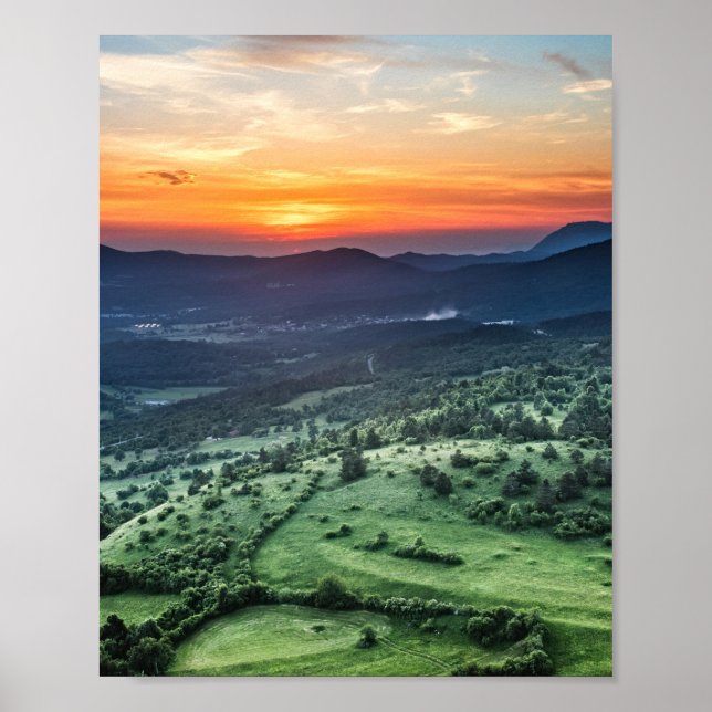 Beautiful sunset behind green fields poster (Front)