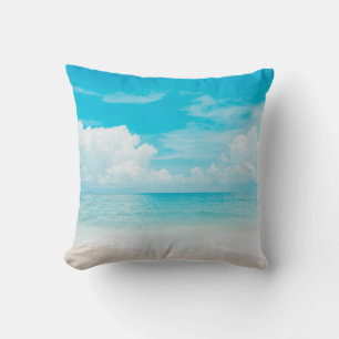 Beautiful tropical beach with blue sky and white c cushion