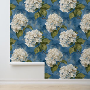 Beautiful white hydrangea on blue wallpaper