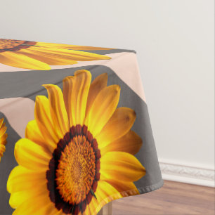 Beautiful yellow flowers on grey, brown stripes tablecloth