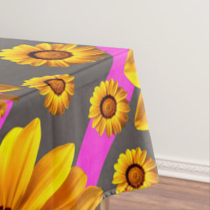 Beautiful yellow flowers on grey, pink stripes tablecloth