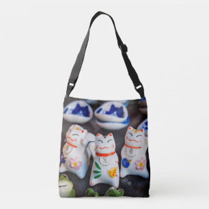 Beckoning cat figurines crossbody bag
