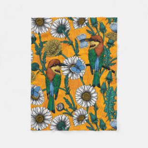 Bee-eaters, blue butterflies and daisies on orange fleece blanket