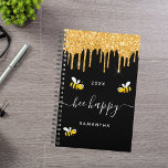 Bee happy black bumble bees glitter monogram 2025 planner<br><div class="desc">Decorated with happy,  smiling yellow and black  bumble bees. A chic black background and faux gold glitter drips,  paint dripping look. White hand lettered script with swashes and the text: Bee Happy.  Personalise and add your name and a year. Perfect for school,  work or organising your personal/family life.</div>