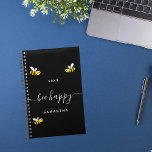 Bee happy black cute bumble bees monogram 2025 planner<br><div class="desc">Decorated with happy,  smiling yellow and black  bumble bees. A chic black background. White hand lettered script with swashes and the text: Bee Happy.  Personalise and add your name and a year. Perfect for school,  work or organising your personal/family life.</div>