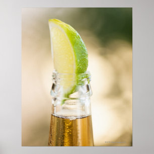 Beer bottle with lime wedge poster