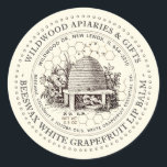 Beeswax Lip Balm Vintage Skep Ivory Honeycomb Classic Round Sticker<br><div class="desc">Custom Lip Balm label with vintage illustration of a bee-hive surrounded by an old world garden with wildflowers,  and little bees. Dotted circle border. Honeycomb Pattern in background. Personalise with your name,  apiary,  location,  cell number,  and ingredient list.</div>