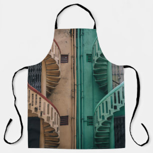 Beige and green concrete spiral stairs beside buil apron