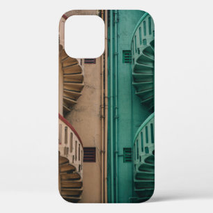 Beige and green concrete spiral stairs beside buil iPhone 12 case