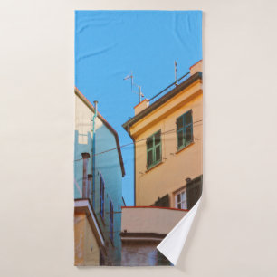 BEIGE CONCRETE HOUSE BESIDE BROWN HOUSE BATH TOWEL