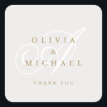 Beige gold elegant classic calligraphy thank you square sticker<br><div class="desc">Modern classic calligraphy couple monogram and names design in neutral beige,  white and gold colour,  simple and elegant. Great wedding favour tags for vintage wedding,   traditional wedding and formal classic wedding 
See all the matching pieces in collection</div>