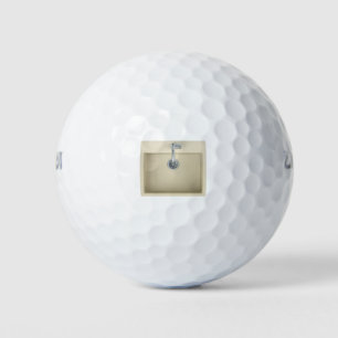 Beige kitchen sink and faucet golf balls