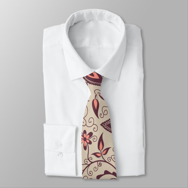 Beige necktie with a bold, artistic floral pattern (Tied)