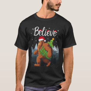 Believe Bigfoot Carrying Christmas Tree Wearing A  T-Shirt