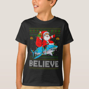 Believe Xmas Funny Santa Riding Shark Ugly Christm T-Shirt