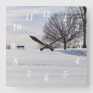 Bench On Snow Covered Hill Wall Clock