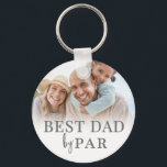 Best Dad By Par Photo Key Ring<br><div class="desc">This personalised keychain for a golf loving dad features a clean and classic design with a soft white gradient background. The phrase Best Dad By Par is displayed at the top in a timeless serif font, giving it a heartfelt and meaningful touch. At the bottom, there’s space for a custom...</div>