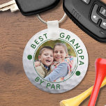 BEST GRANDPA BY PAR Photo Golf Ball Custom Key Ring<br><div class="desc">Create a unique, personalized photo keychain for the golfer grandfather with the editable funny golf title BEST GRANDPA BY PAR and your custom text in your choice of colors (shown in green) on a golf ball image. The design is duplicated on both sides. ASSISTANCE: For help with design modification or...</div>