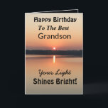 Best Grandson Light Shines Bright Birthday Card<br><div class="desc">Express your wishes to your grandson for a happy day on an inspirational sunset birthday card with the verse “Your Light Shines Bright”. The minimal design is modern with bold colours of gold and black showing glowing water and a peaceful lake.</div>