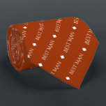Best Man Repeating White Text on Rust Orange Tie<br><div class="desc">This fun neck tie is the perfect accessory for the best man at your wedding. It features a simple yet elegant design with the words "Best Man" written in fancy all capital white text repeating in a diagonal pattern on a rust orange or burnt umber coloured background. There are diamonds...</div>