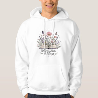 Between books and blooms book lover reader hoodie