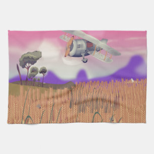 Bi-Plane Flying over crops under setting sun Tea Towel