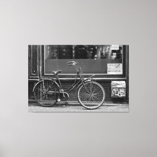 Bicycle in fornt of shop window canvas print
