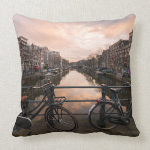 Bicycles at sunset in Amsterdam Cushion