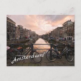 Bicycles at sunset in Amsterdam Postcard