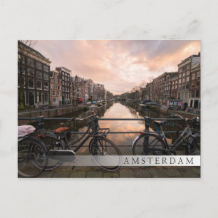 Bicycles at sunset in Amsterdam Postcard