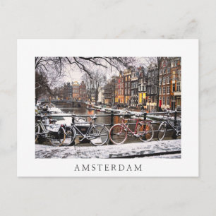 Bicycles in the snow in Amsterdam Postcard