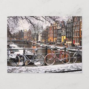 Bicycles in the snow in Amsterdam Postcard