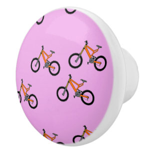 Bicycles pattern on pink ceramic knob