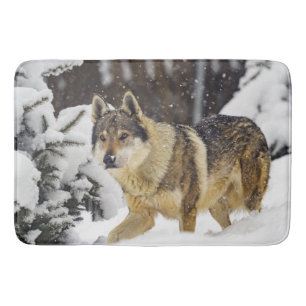 Big Beautiful Grey Wild Wolf in snow Bath Mat