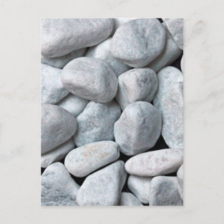 Big pile of grey and white stones from the beach postcard