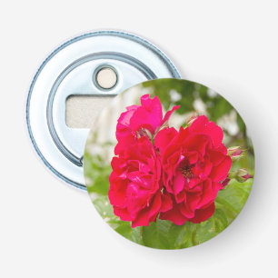 Big red roses in the garden bottle opener
